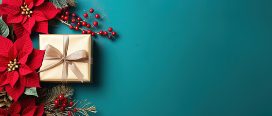 turquoise christmas background with poinsettia with leaves, red berries, gift box wrapped red silk ribbon, gold tinsel, with empty copy Space