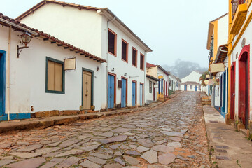 Fog apparent on the stone streets and colonial houses in the historic city of Tiradentes, Minas Gerais, Brazil.