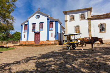 Cart and horse on a street in the city of Tiradentes, Minas Gerais, Brazil. Old wagon for a ride in the historic colonial city