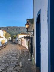 Street with colonial houses in the city of Tiradentes in Minas Gerais with mountains in the background