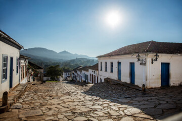 Street with colonial houses in the city of Tiradentes in Minas Gerais with mountains in the background