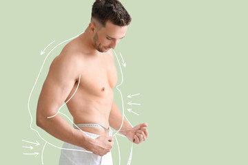 Muscled young man after weight loss measuring his waist on green background - Powered by Adobe