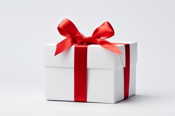 White Gift Box with Red Ribbon on White Background