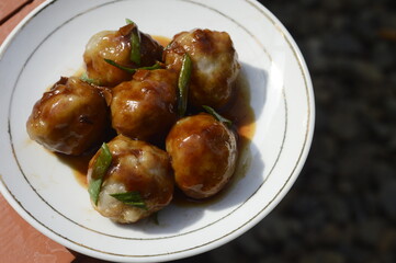 meatball or bakso on a white plate, traditional food from Indonesia