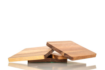 Set of four wooden coasters made of pine, macro, isolated on white background.