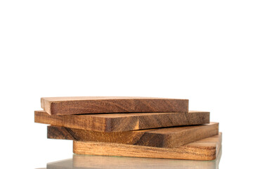 Set of four wooden coasters made of pine, macro, isolated on white background.