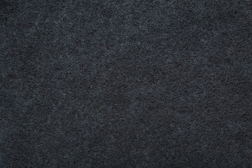 Background of new dark black charcoal filter for kitchen cooker hood. Closeup. Top down view.
