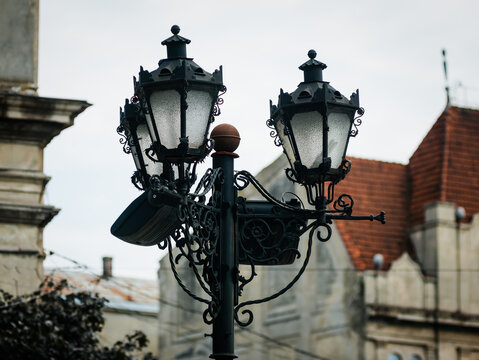 Street lamppost with three antique-style lanterns