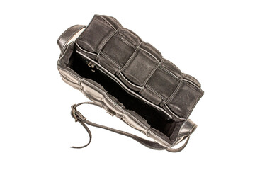 One leather women's bag, macro, isolated on white background, top view.