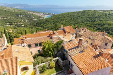 Tuinposter View from the historic town of Labin in Istria to the Croatian seaside resort of Rabac in summer © Aquarius