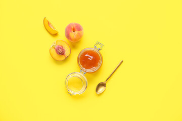 Glass jar of sweet peach jam and fresh fruits on yellow background - obrazy, fototapety, plakaty