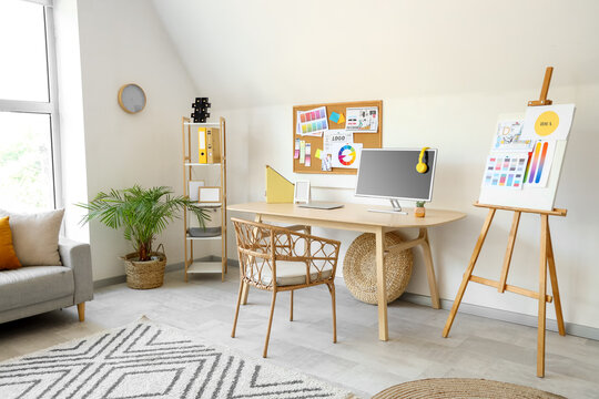 Interior designer's workplace with computer in office