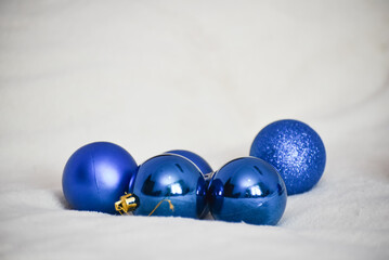 Blue christmas balls on white blanket , Chrismas decoration. New year time