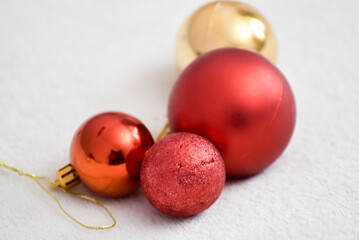  New year decoration, Christmas red balls on white cover. Festive background