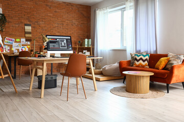Interior designer's workplace with computer monitor in office