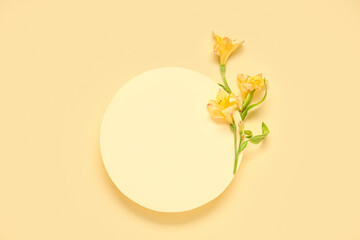 Composition with blank paper sheet and beautiful alstroemeria flowers on beige background
