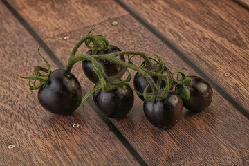 Ripe tasty black cherry tomato