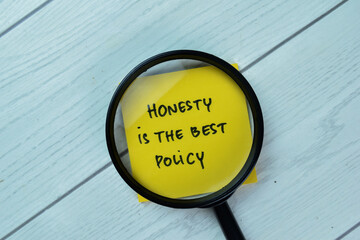 Concept of Honesty Is The Best Policy write on sticky notes isolated on Wooden Table.