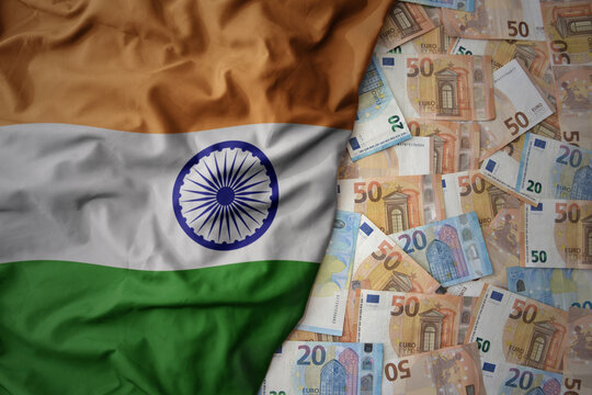 colorful waving national flag of india on a euro money background. finance concept