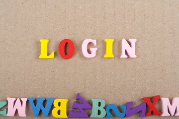 LOGIN word on wooden background composed from colorful abc alphabet block wooden letters, copy space for ad text. Learning english concept.
