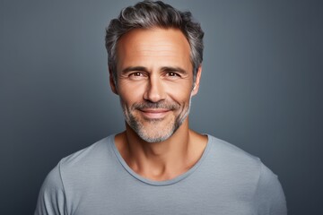 Fototapeta premium Mature smiling man studio portrait. AI generative