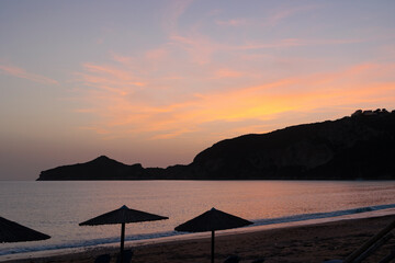 Sunset over the sea and the bay of Agios Georgios on the island of Corfu