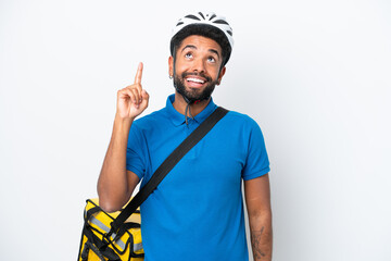 Young Brazilian man with thermal backpack isolated on white background pointing up and surprised