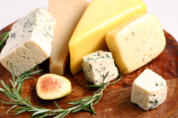 Tasty cheese with fig and rosemary on plate