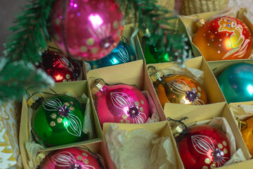 Vintage glass balls in a box under the Christmas tree.