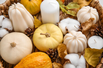 Wicker tray with candles and beautiful autumn decor, closeup