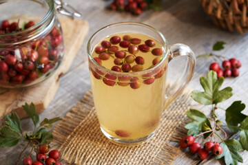 Hawthorn berry tea in a glass cup