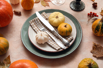 Beautiful table setting for Thanksgiving Day celebration on grunge beige background