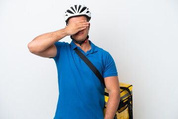 Young caucasian man with thermal backpack isolated on white background covering eyes by hands. Do not want to see something