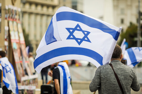 Details with a man holding an Israeli flag during a pro Israelian rally.