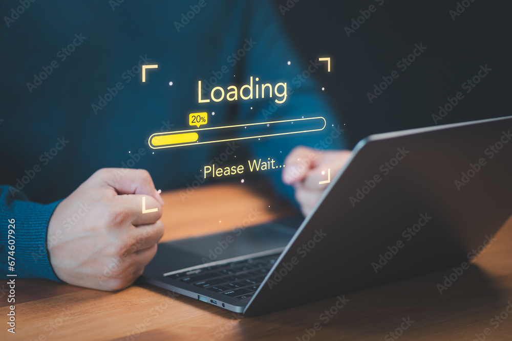 Poster User use a laptop computer to download and update software with waiting to load digital file data from the website, and very slow internet from wifi. Concept of waiting for a load of loading symbol.