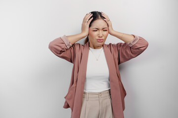 A sad Asian woman employee wears cardigan, looks stressed and depressed, isolated white background.