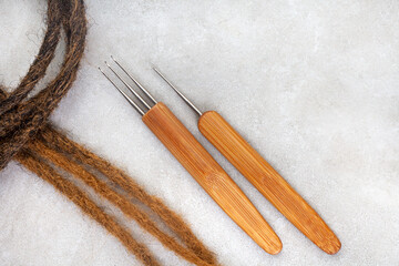 Hair crochet needles for dreadlocks and braids on grey