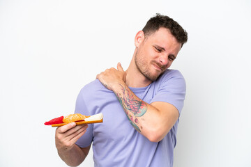 Young caucasian man holding sashimi isolated on white background suffering from pain in shoulder for having made an effort