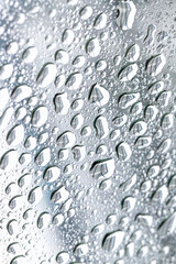 Water droplets on a metallic surface. Abstract background of water drops.