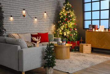 Interior of festive living room with Christmas trees, glowing lights and decor