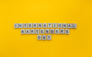 February 6, International Bartenders Day, minimalistic banner with the inscription in wooden letters
