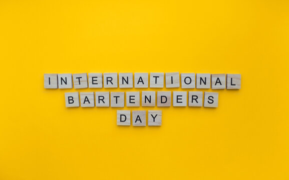 February 6, International Bartenders Day, minimalistic banner with the inscription in wooden letters