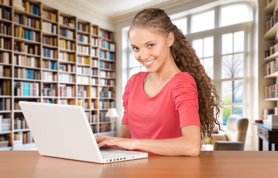 Positive beautiful teenage student watching online class, AI generated image