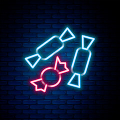 Glowing neon line Candy icon isolated on brick wall background. Happy Halloween party. Colorful outline concept. Vector