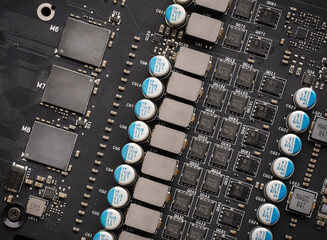 Electronic components and video card microchips. Close-up of an electronic board with SMD...
