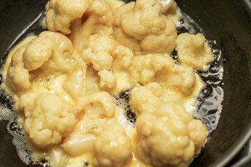 Vegetables Cauliflower fried in a batter of egg and flour