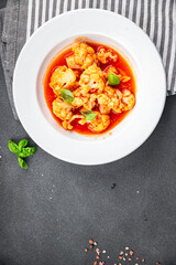 cauliflower tomato sauce stewed vegetable second course healthy eating cooking appetizer meal food snack on the table copy space food background rustic top view 