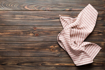 top view with red empty kitchen napkin isolated on table background. Folded cloth for mockup with copy space, Flat lay. Minimal style - Powered by Adobe