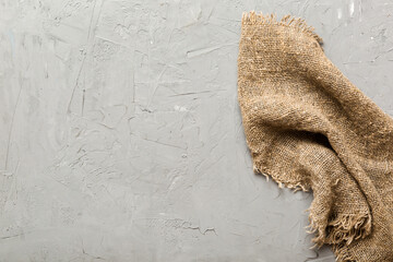 Old burlap fabric napkin, sackcloth on table background. top view with copy space