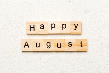 Happy august word written on wood block. Happy august text on table, concept